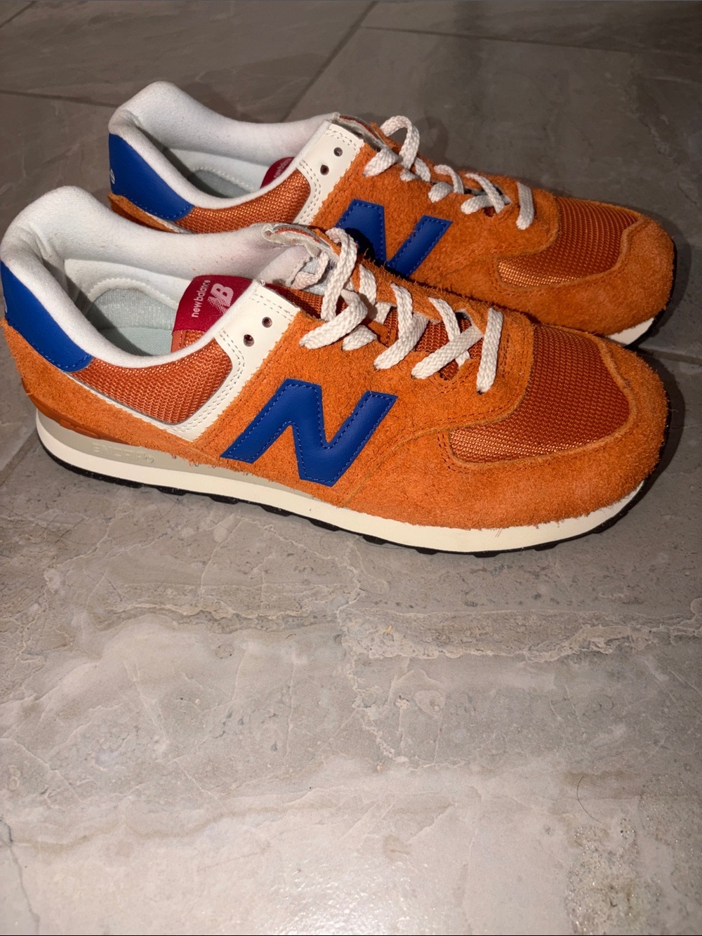 New Balance Men’s Orange Suede Sneakers with Blue Accent